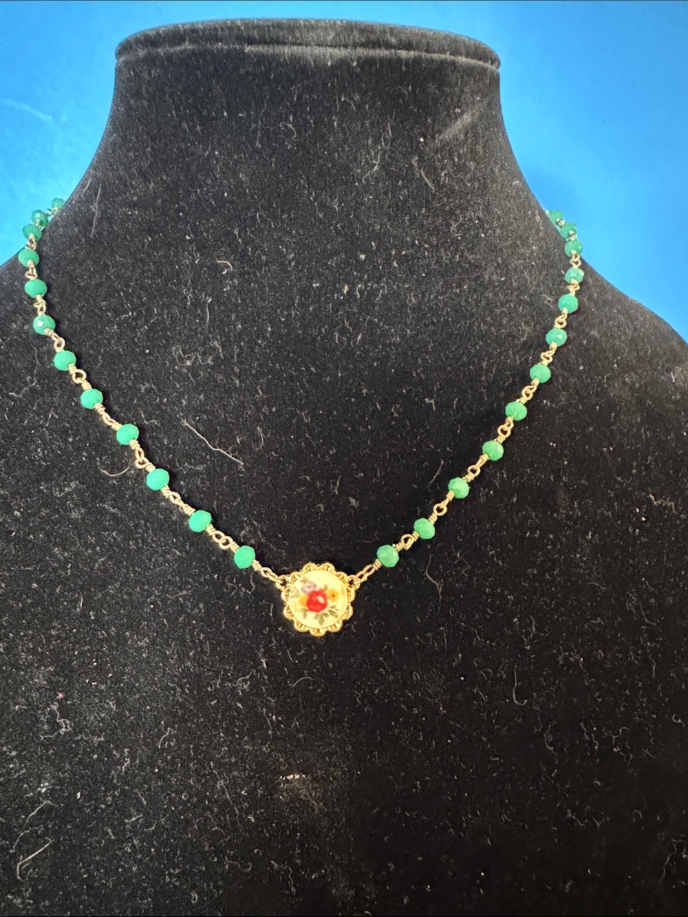 Plunder Gold-Tone Necklace with Green Beads and Red Center